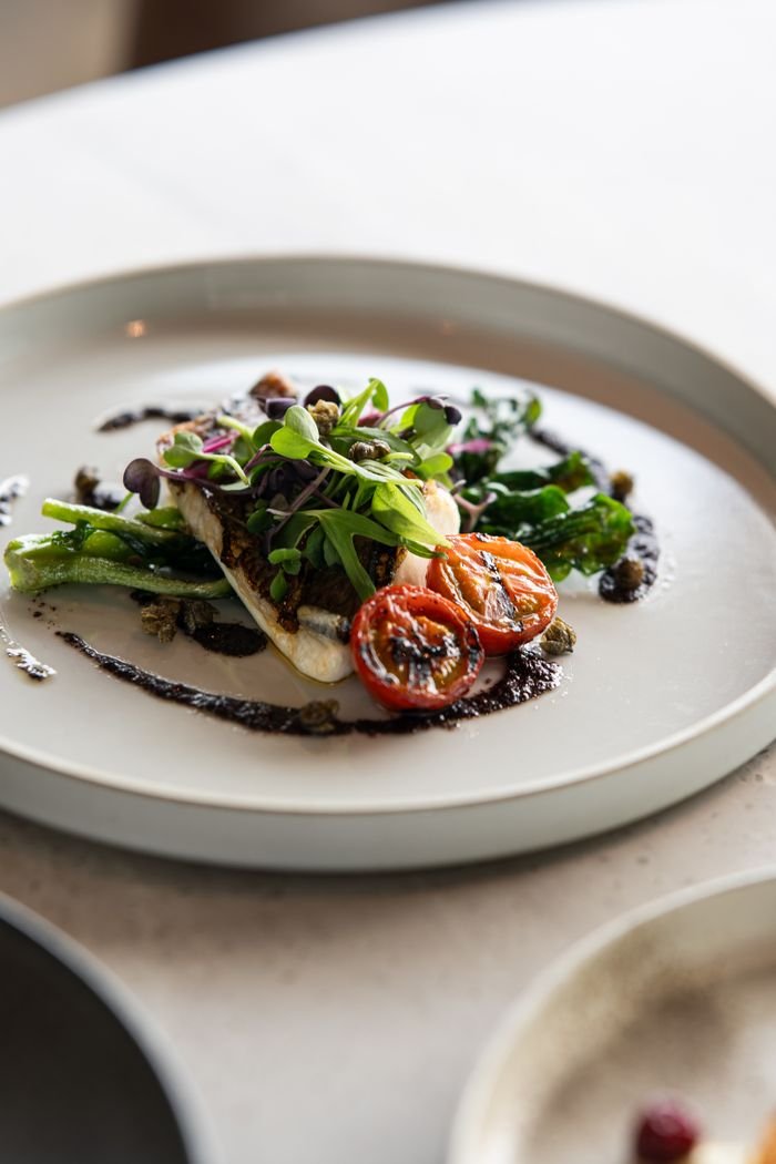 The Art of Drawing Readers In: Your attractive post title goes here Elegant plating of grilled fish and vegetables, showcasing fine dining in Tokyo.